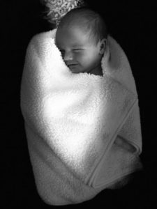 Black and white image of a newborn baby