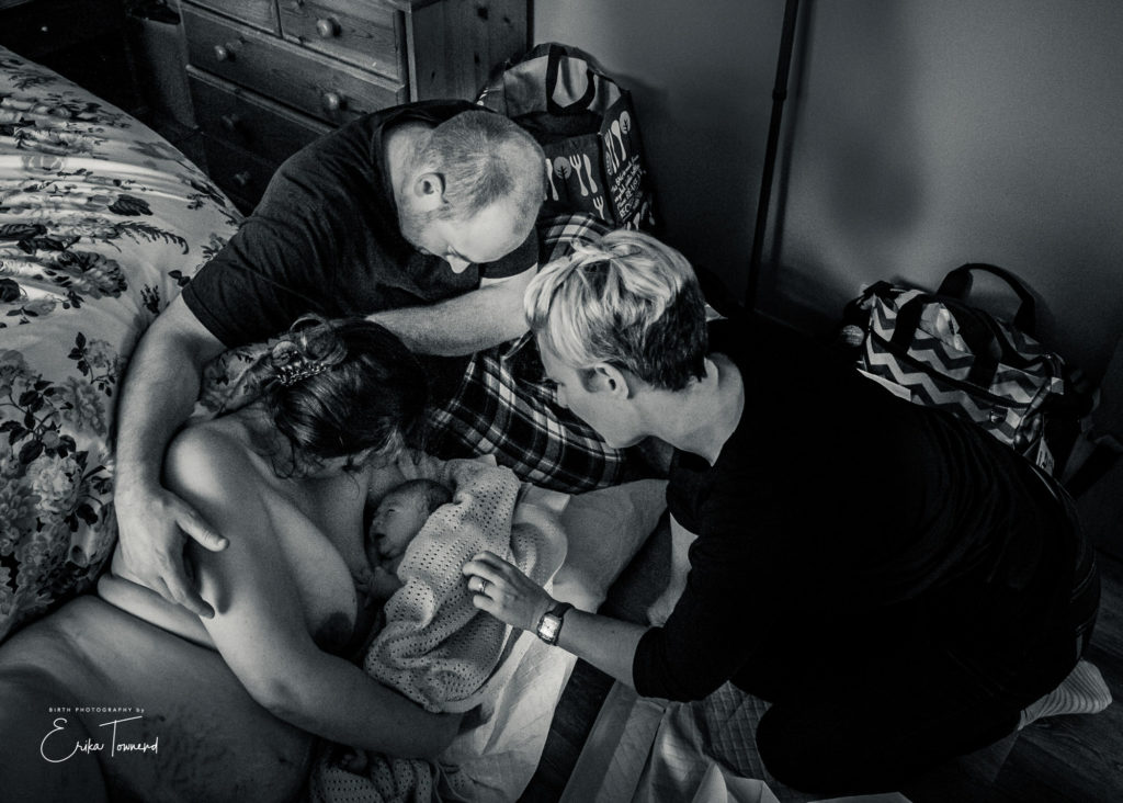 Black and white image of meeting their new baby after a homebirth with a midiwfe by Erika Townend Birth